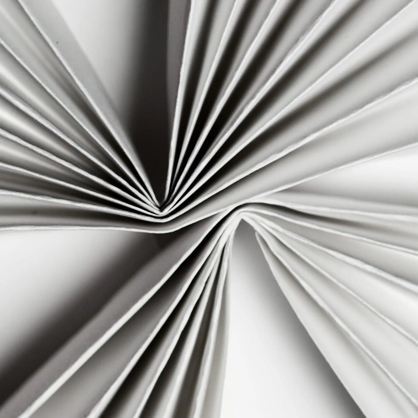 Close-up of the fanned pages of a document converging to a point